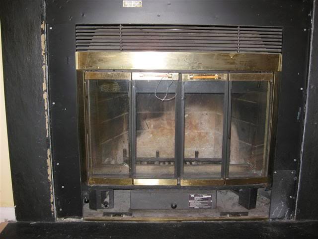 An old fireplace that needs to be replaced.