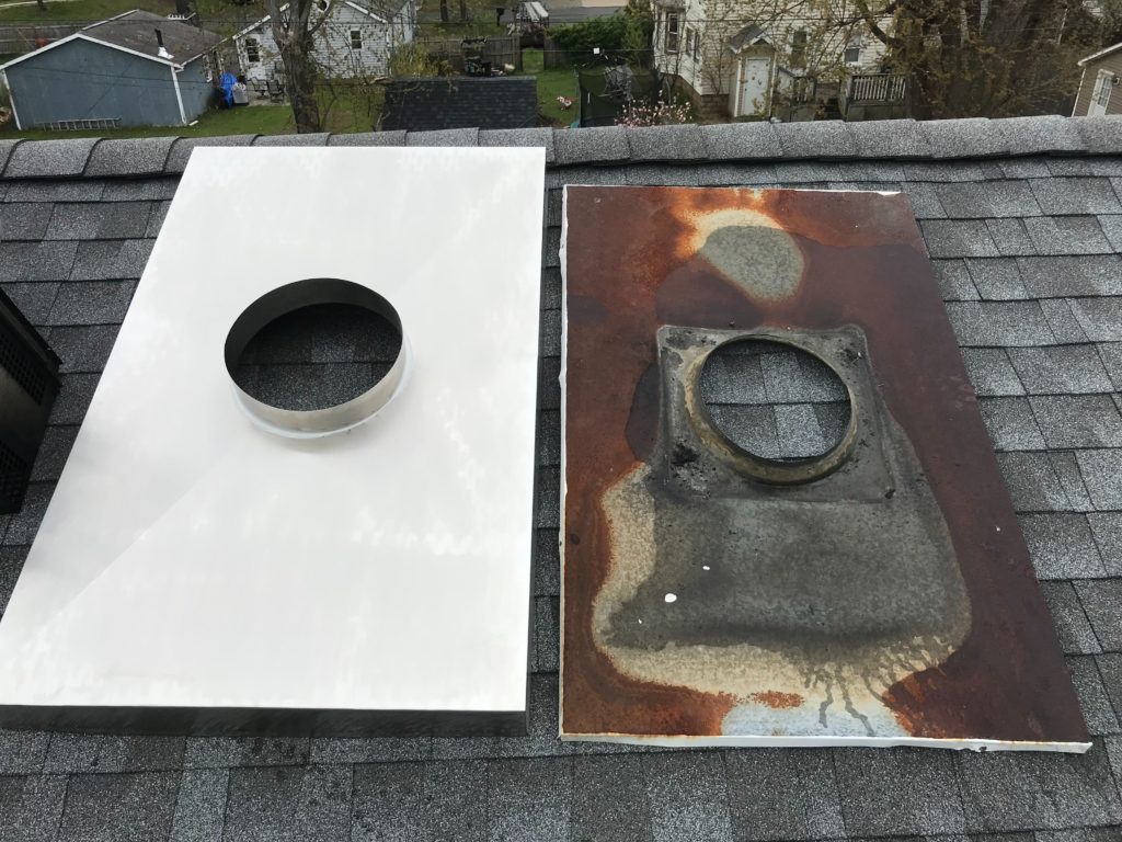 Old chimney chase cover next to a replacement.